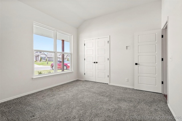 2916 S 8th St, Broken Arrow, OK 74012 - unfurnished bedroom with carpet, lofted ceiling, and a closet
