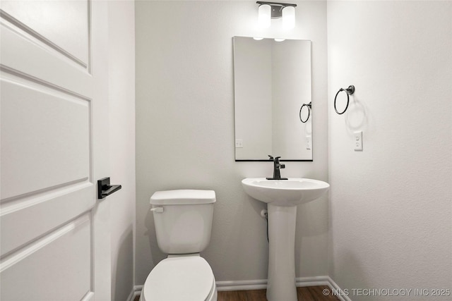 2916 S 8th St, Broken Arrow, OK 74012 - bathroom featuring toilet and wood finished floors