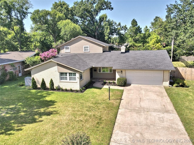 5654 S Marion Ave, Tulsa, OK 74135 - view of front facade with brick siding, an attached garage, roof with shingles, driveway, and a chimney