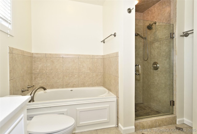 5654 S Marion Ave, Tulsa, OK 74135 - full bathroom featuring a garden tub, a stall shower, tile patterned floors, and vanity