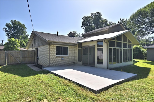 5654 S Marion Ave, Tulsa, OK 74135 - back of house featuring a patio, brick siding, a chimney, a sunroom, and a gate