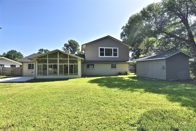 5654 S Marion Ave, Tulsa, OK 74135 - rear view of house with a storage shed, a sunroom, a patio area, and brick siding