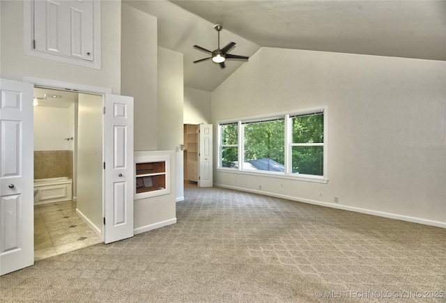 5654 S Marion Ave, Tulsa, OK 74135 - unfurnished living room featuring carpet flooring, a ceiling fan, high vaulted ceiling, and tile patterned floors