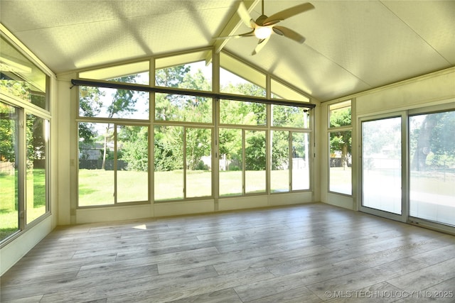 5654 S Marion Ave, Tulsa, OK 74135 - unfurnished sunroom with vaulted ceiling, wood finished floors, and a deck
