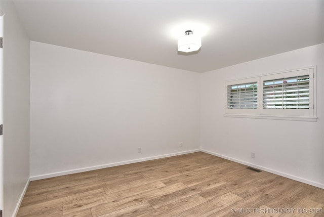 5654 S Marion Ave, Tulsa, OK 74135 - spare room featuring light wood-type flooring and baseboards