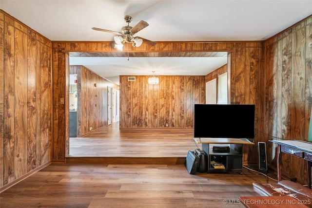 2321 S Main St, Sapulpa, OK 74066 - living room with ceiling fan, wooden walls, and wood finished floors