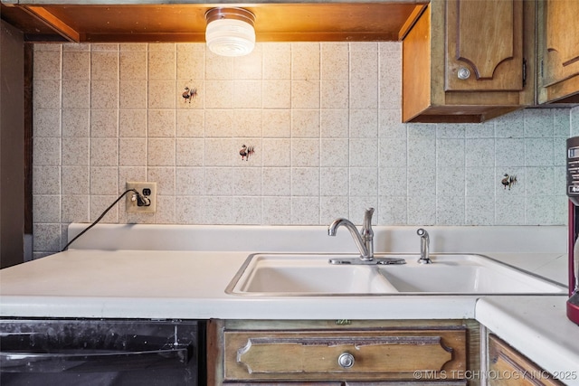 2321 S Main St, Sapulpa, OK 74066 - kitchen featuring black dishwasher and light countertops