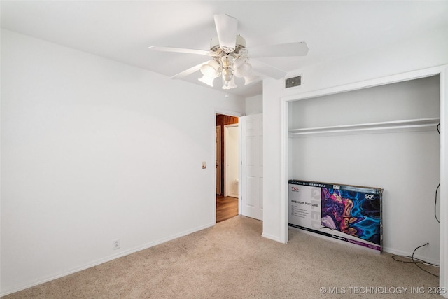 2321 S Main St, Sapulpa, OK 74066 - unfurnished bedroom featuring carpet, a closet, and a ceiling fan