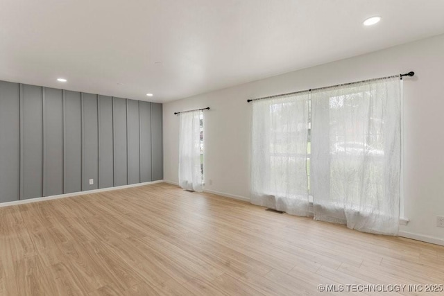 6016 S 76th E Ave, Tulsa, OK 74145 - unfurnished room featuring wood finished floors and recessed lighting