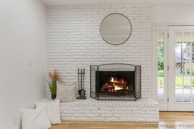 6016 S 76th E Ave, Tulsa, OK 74145 - detailed view of a brick fireplace and wood finished floors