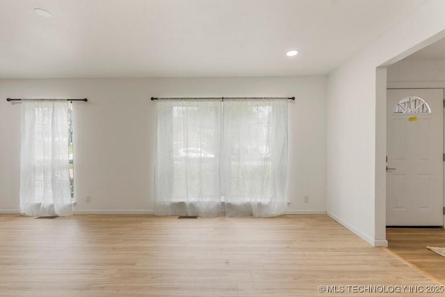 6016 S 76th E Ave, Tulsa, OK 74145 - empty room featuring wood finished floors, plenty of natural light, and recessed lighting