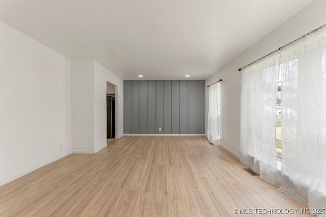 6016 S 76th E Ave, Tulsa, OK 74145 - empty room featuring light wood finished floors and baseboards