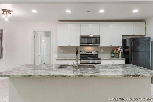 6016 S 76th E Ave, Tulsa, OK 74145 - kitchen featuring appliances with stainless steel finishes, white cabinets, recessed lighting, and light stone counters