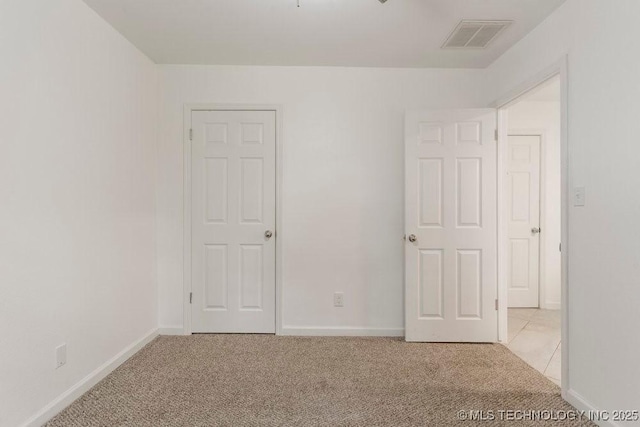 6016 S 76th E Ave, Tulsa, OK 74145 - unfurnished bedroom with light carpet and baseboards