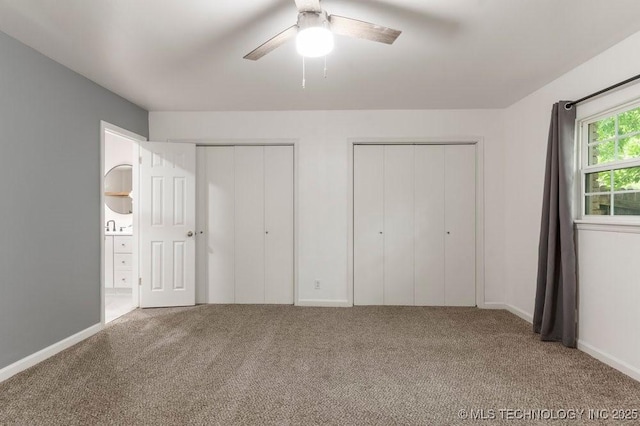 6016 S 76th E Ave, Tulsa, OK 74145 - unfurnished bedroom with two closets, carpet, ceiling fan, and ensuite bath