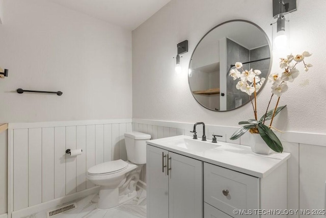 6016 S 76th E Ave, Tulsa, OK 74145 - bathroom with marble finish flooring, vanity, and a wainscoted wall