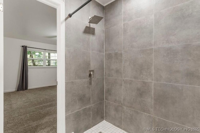 6016 S 76th E Ave, Tulsa, OK 74145 - bathroom featuring tiled shower and baseboards
