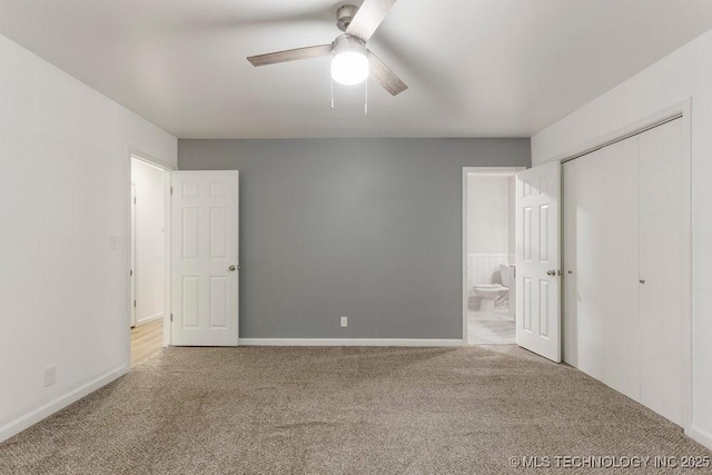 6016 S 76th E Ave, Tulsa, OK 74145 - unfurnished bedroom featuring carpet floors, ensuite bathroom, a ceiling fan, and a closet