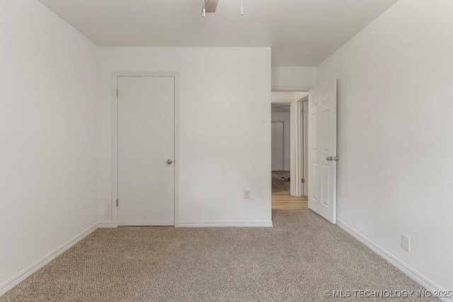 6016 S 76th E Ave, Tulsa, OK 74145 - unfurnished bedroom featuring carpet floors and baseboards