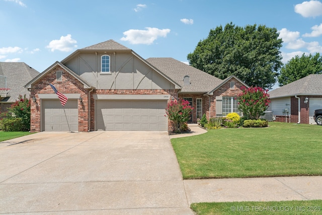 12432 S 101st E Ave, Bixby, OK 74008 - view of front of home with a front lawn, brick siding, concrete driveway, a garage, and stucco siding