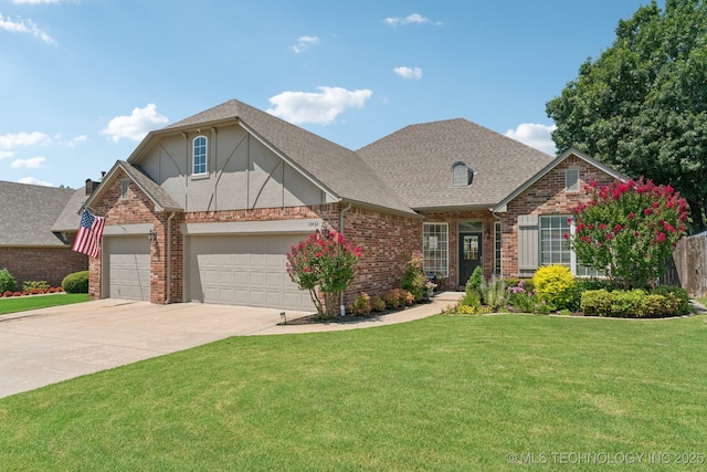 12432 S 101st E Ave, Bixby, OK 74008 - view of front facade featuring a front lawn, concrete driveway, brick siding, an attached garage, and a shingled roof
