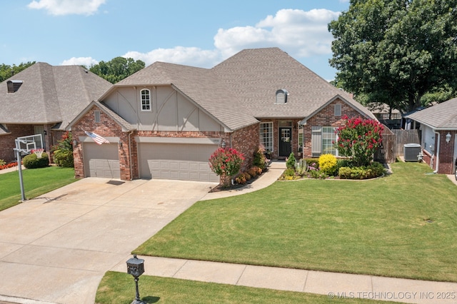 12432 S 101st E Ave, Bixby, OK 74008 - craftsman inspired home featuring a front yard, driveway, stucco siding, brick siding, and an attached garage
