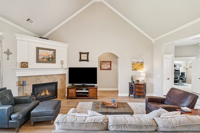 12432 S 101st E Ave, Bixby, OK 74008 - living area with light wood-type flooring, high vaulted ceiling, and a fireplace