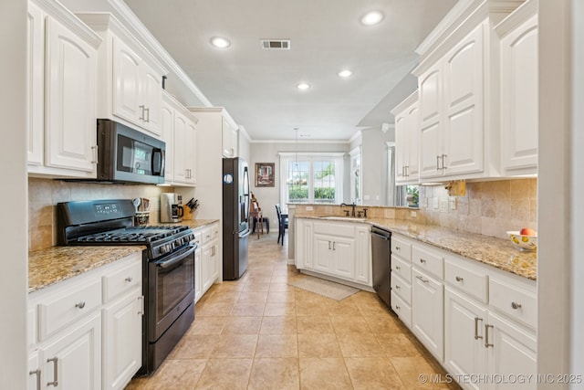 12432 S 101st E Ave, Bixby, OK 74008 - kitchen featuring stainless steel appliances, ornamental molding, white cabinets, a peninsula, and recessed lighting