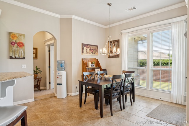 12432 S 101st E Ave, Bixby, OK 74008 - dining room with arched walkways, crown molding, a chandelier, and light tile patterned flooring