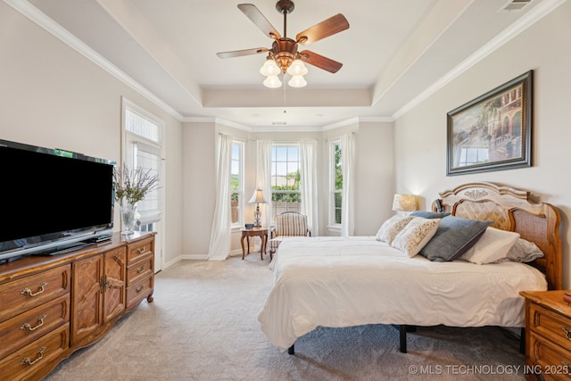 12432 S 101st E Ave, Bixby, OK 74008 - bedroom featuring a raised ceiling, multiple windows, light carpet, ornamental molding, and ceiling fan