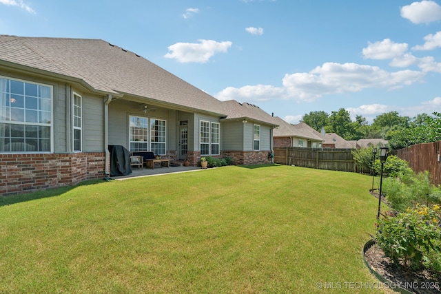 12432 S 101st E Ave, Bixby, OK 74008 - fenced backyard featuring ceiling fan and a patio