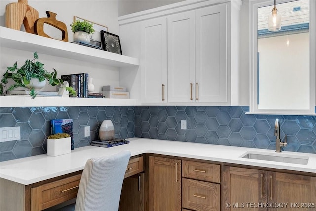 1207 N 71st Pl, Broken Arrow, OK 74014 - kitchen with open shelves, tasteful backsplash, white cabinetry, and light countertops