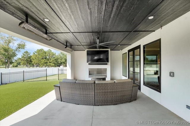 1207 N 71st Pl, Broken Arrow, OK 74014 - view of patio / terrace with a ceiling fan and an outdoor living space with a fireplace