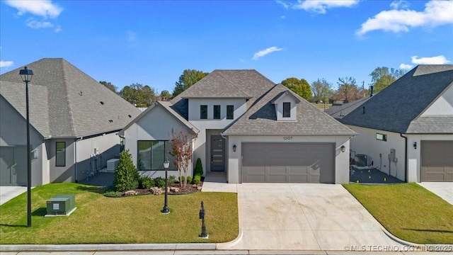 1207 N 71st Pl, Broken Arrow, OK 74014 - view of front facade with stucco siding, an attached garage, concrete driveway, a front lawn, and a shingled roof