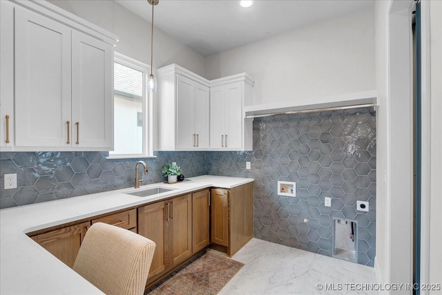1207 N 71st Pl, Broken Arrow, OK 74014 - kitchen with light countertops, decorative light fixtures, marble finish floors, and white cabinets