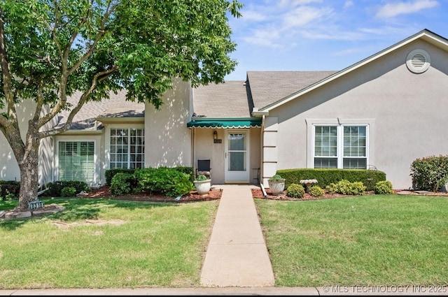 8318 S 84th E Ave, Tulsa, OK 74133 - view of front of property with a front yard, stucco siding, and a shingled roof