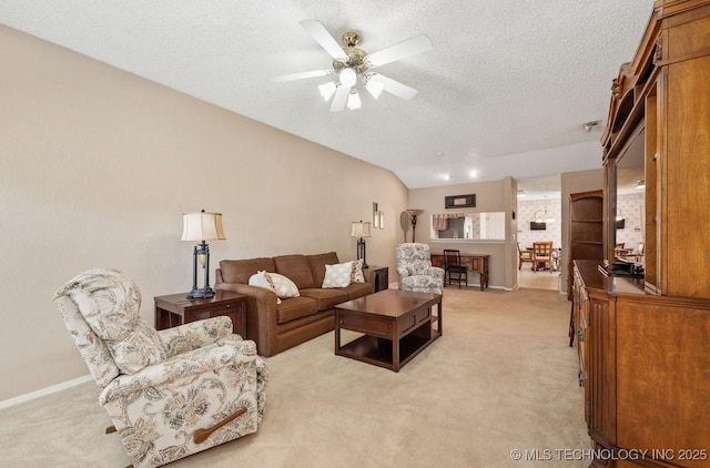 8318 S 84th E Ave, Tulsa, OK 74133 - living area featuring light colored carpet, a ceiling fan, and a textured ceiling