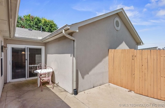 8318 S 84th E Ave, Tulsa, OK 74133 - view of property exterior with a patio area and stucco siding