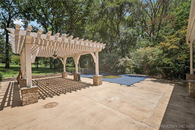 3437 E 96th Pl, Tulsa, OK 74137 - view of patio / terrace featuring a pergola, a covered pool, and view of scattered trees