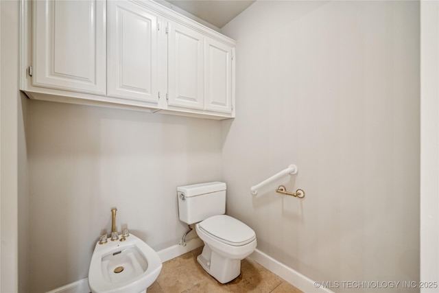 3437 E 96th Pl, Tulsa, OK 74137 - half bathroom with a bidet and tile patterned floors