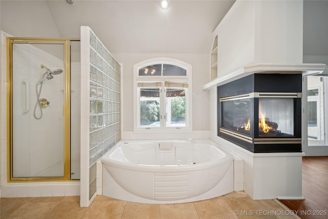 3437 E 96th Pl, Tulsa, OK 74137 - bathroom featuring a jetted tub, a multi sided fireplace, and a stall shower