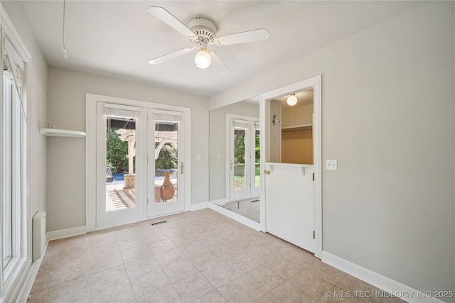 3437 E 96th Pl, Tulsa, OK 74137 - unfurnished room featuring a ceiling fan, french doors, and light tile patterned floors