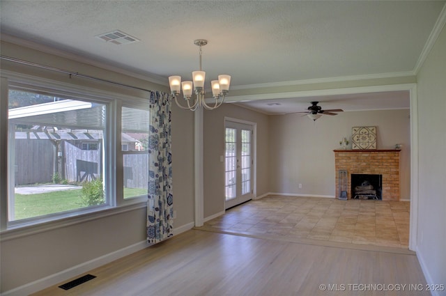 4424 E 59th Pl S, Tulsa, OK 74135 - unfurnished living room featuring crown molding, a chandelier, wood finished floors, a fireplace, and ceiling fan