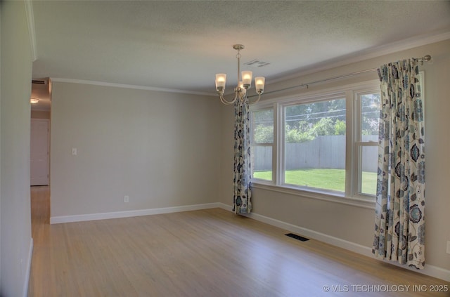 4424 E 59th Pl S, Tulsa, OK 74135 - spare room featuring a chandelier, ornamental molding, light wood finished floors, and a textured ceiling