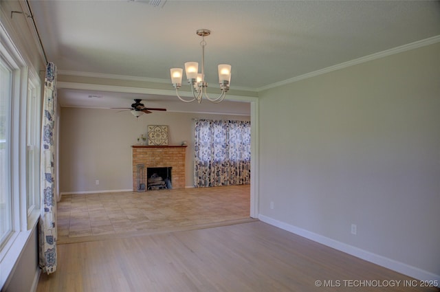 4424 E 59th Pl S, Tulsa, OK 74135 - unfurnished living room with a ceiling fan, a chandelier, a fireplace, wood finished floors, and ornamental molding