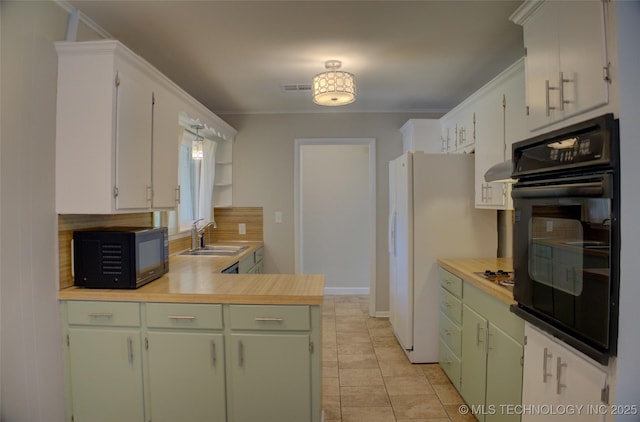 4424 E 59th Pl S, Tulsa, OK 74135 - kitchen featuring black appliances, backsplash, light countertops, and light tile patterned floors