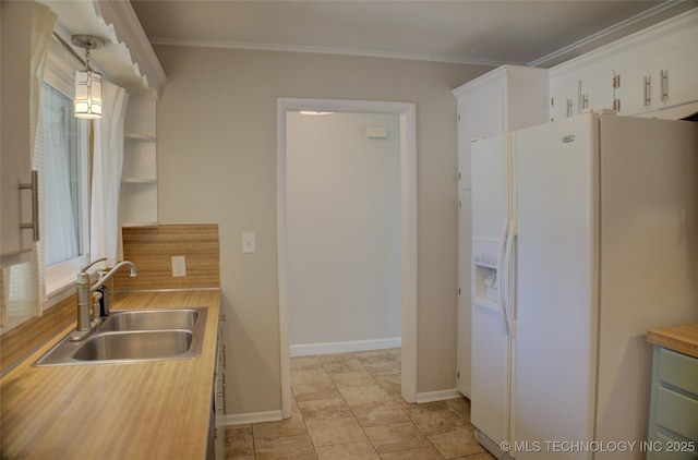 4424 E 59th Pl S, Tulsa, OK 74135 - kitchen with white fridge with ice dispenser, ornamental molding, white cabinetry, and tasteful backsplash