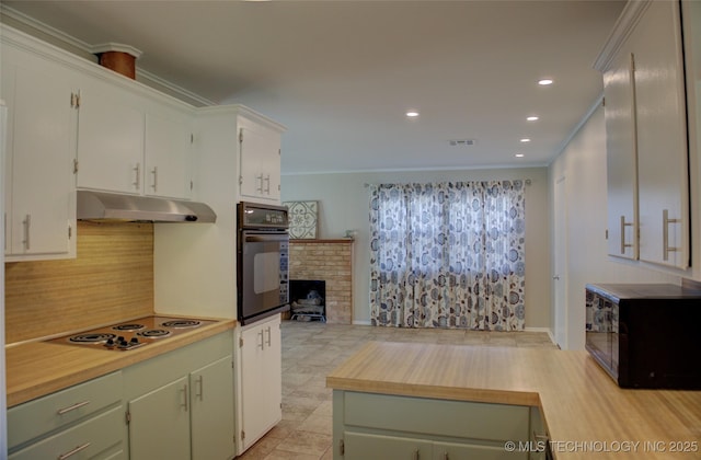4424 E 59th Pl S, Tulsa, OK 74135 - kitchen featuring black appliances, under cabinet range hood, decorative backsplash, crown molding, and recessed lighting