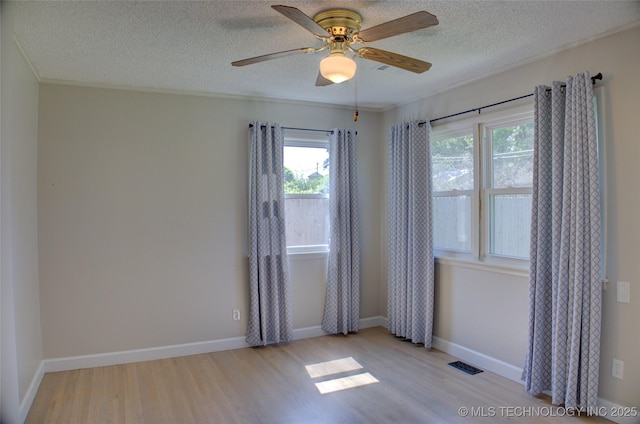 4424 E 59th Pl S, Tulsa, OK 74135 - unfurnished room featuring wood finished floors, a textured ceiling, a ceiling fan, and crown molding