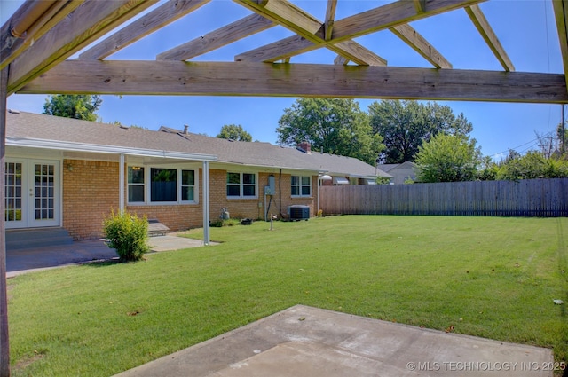 4424 E 59th Pl S, Tulsa, OK 74135 - fenced backyard with a patio, a pergola, and french doors